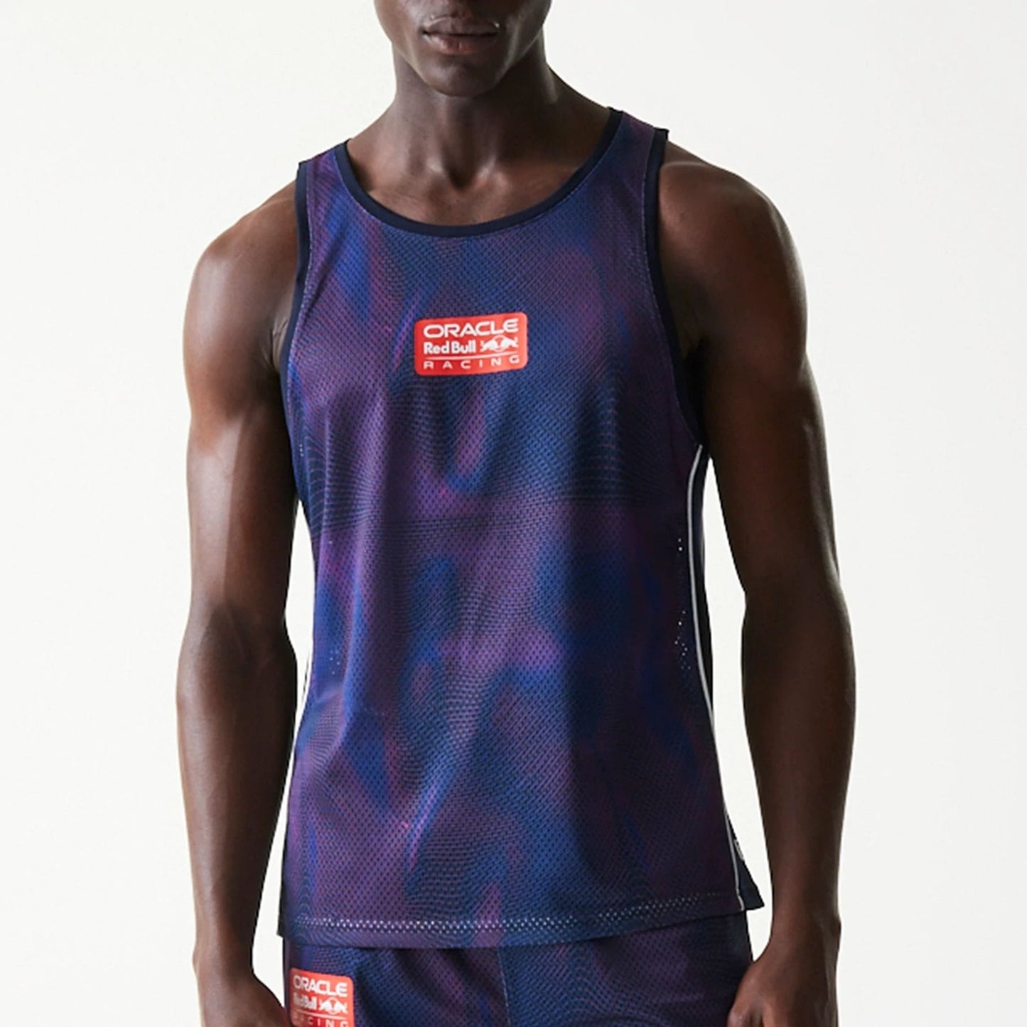 The model is wearing this Red Bull Racing Mesh Tank Top in dark blue. 3