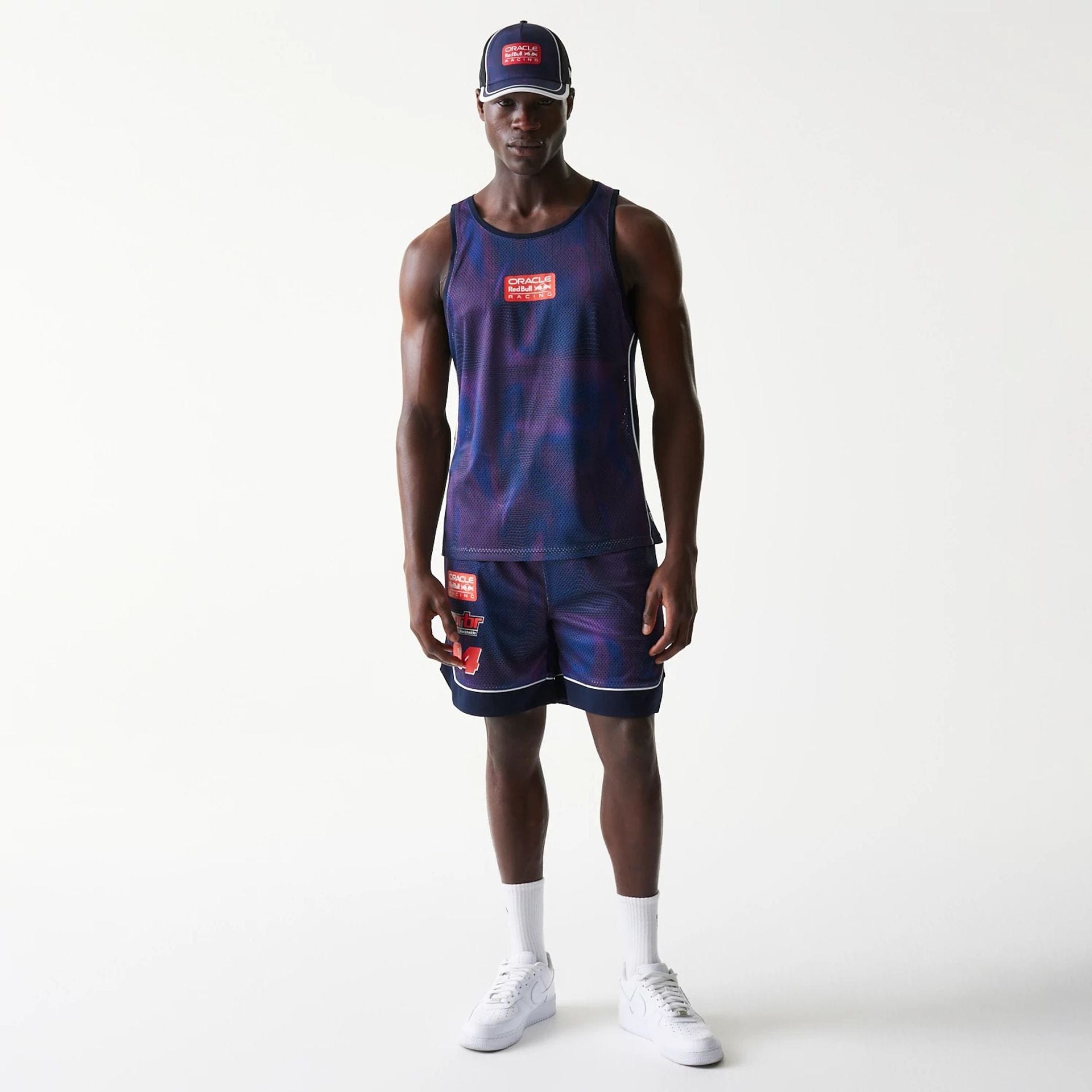 The model is wearing this Red Bull Racing Mesh Tank Top in dark blue. 8