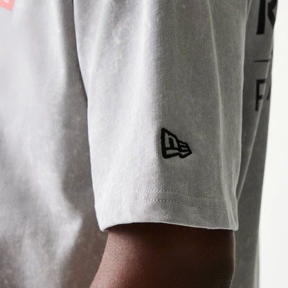 The model is wearing this Red Bull Racing Linear Graphic Oversized T-Shirt in grey. 5