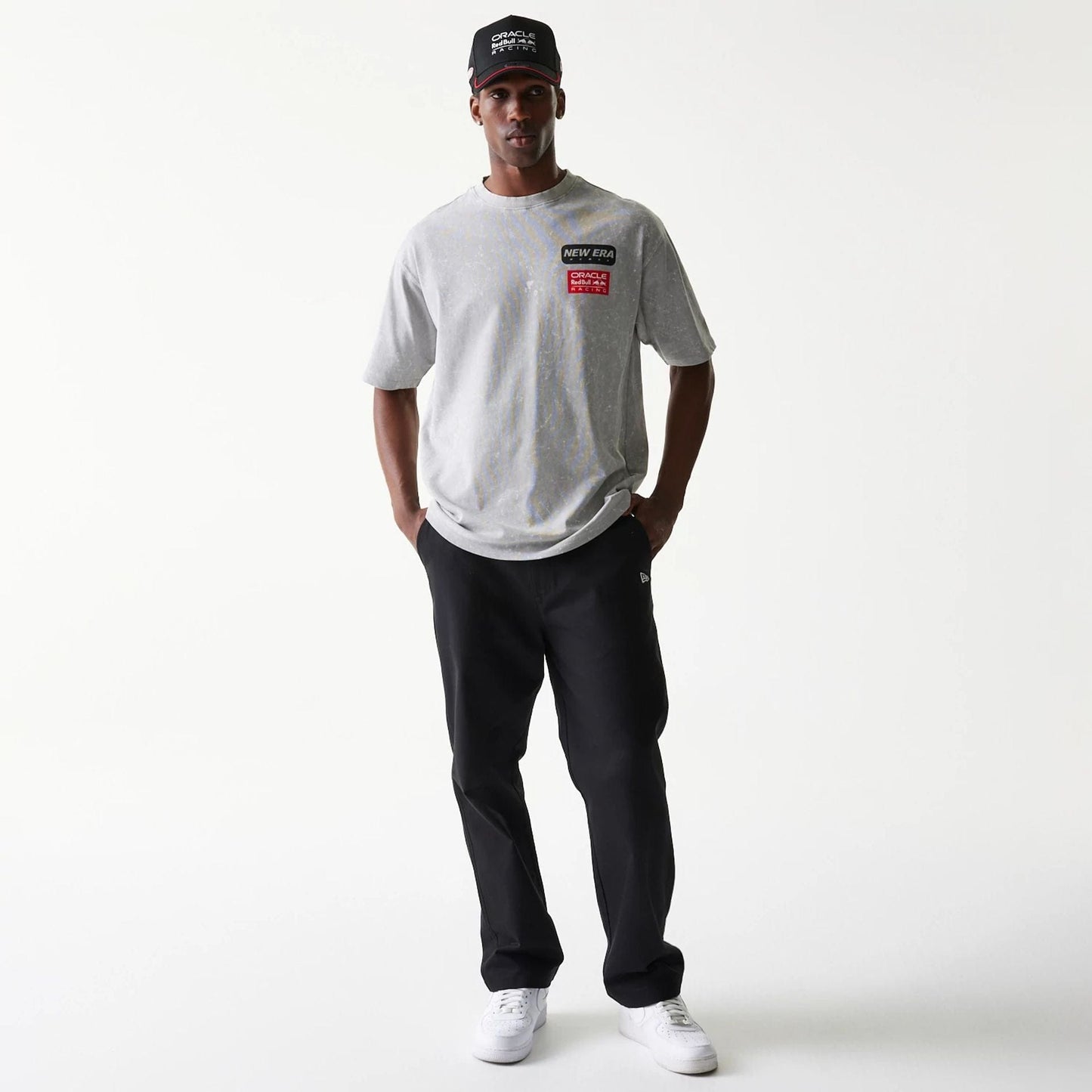 The model is wearing this Red Bull Racing Linear Graphic Oversized T-Shirt in grey. 8