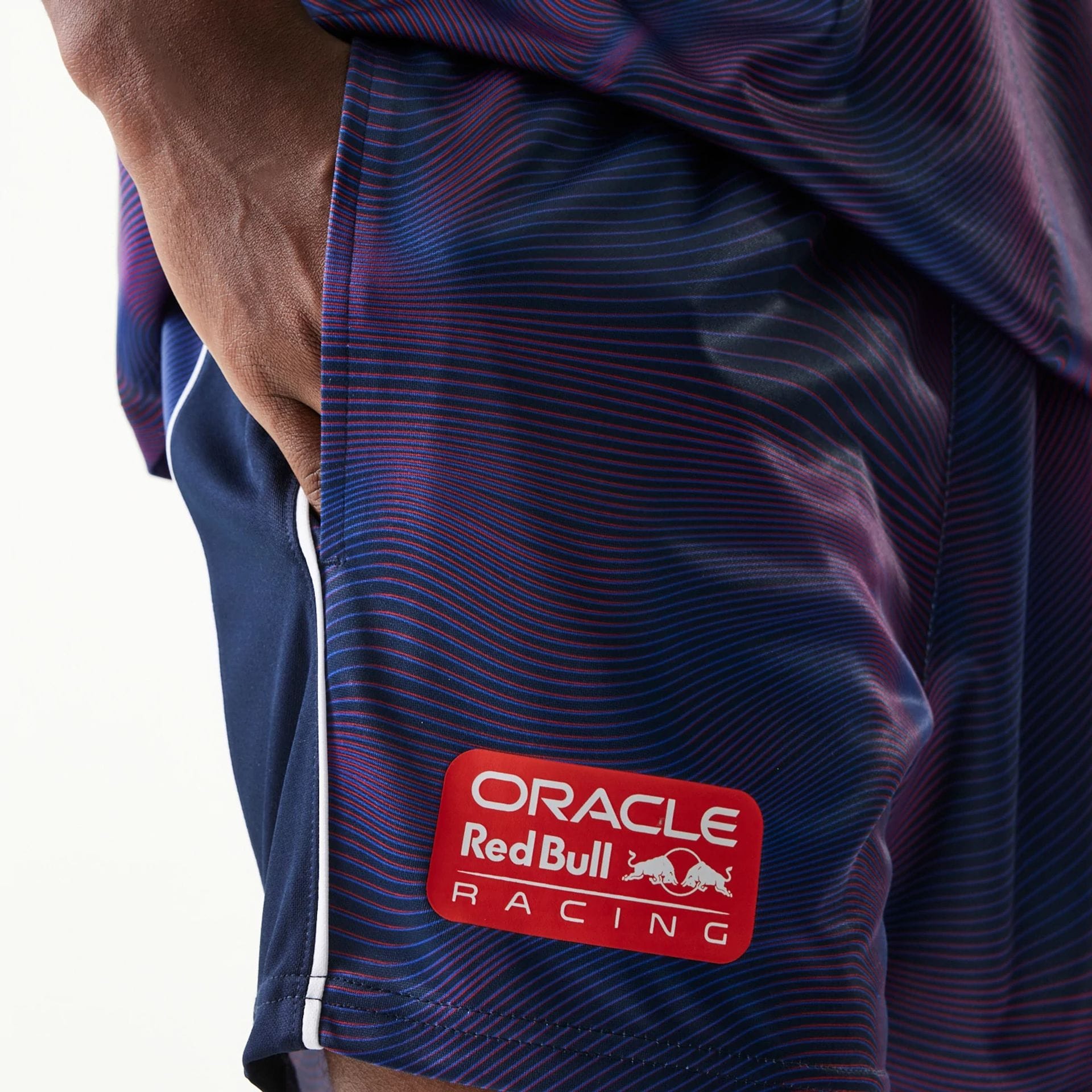 The model is wearing this Red Bull Racing All Over Print Football Shorts in dark blue. 3