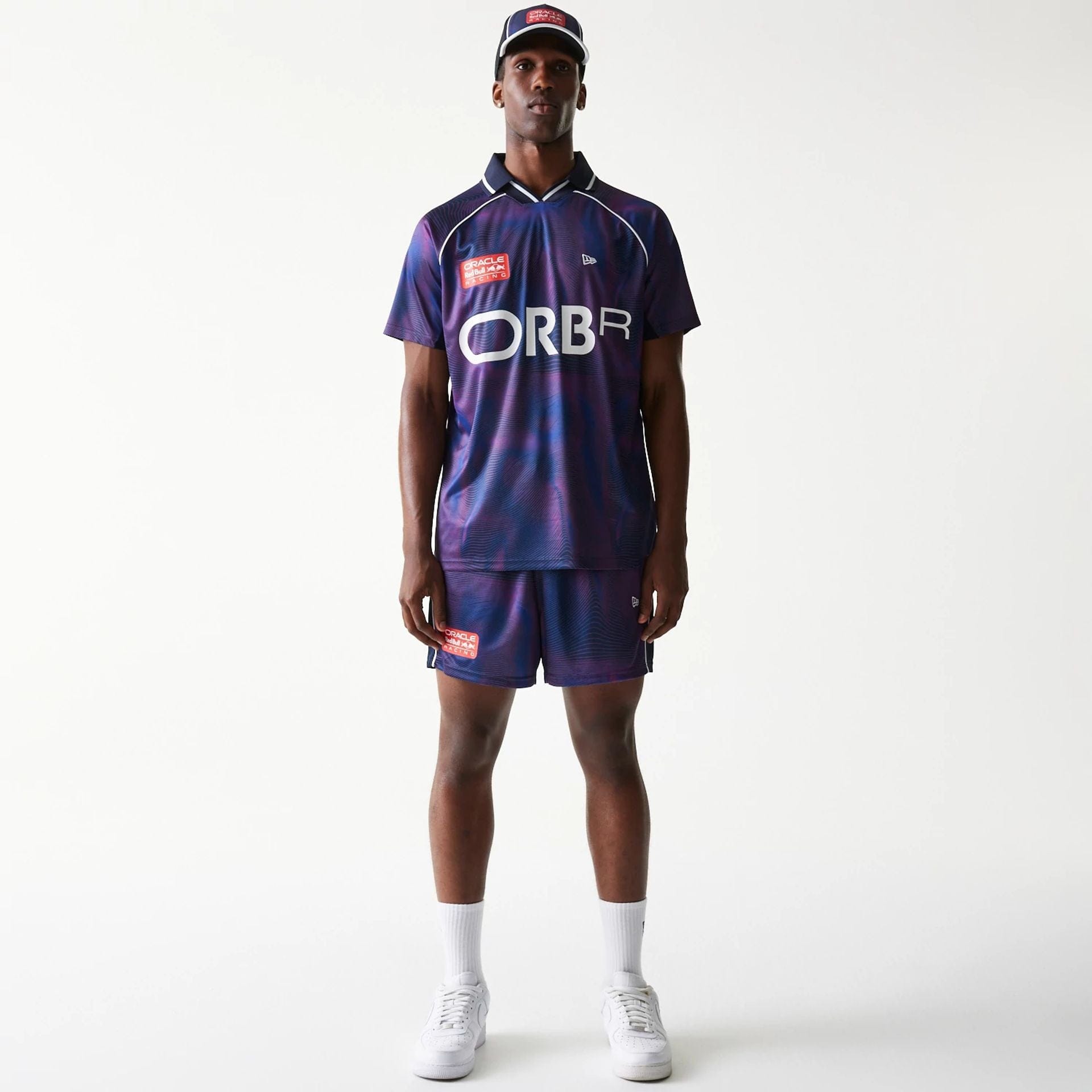 The model is wearing this Red Bull Racing All Over Print Football Shorts in dark blue. 8