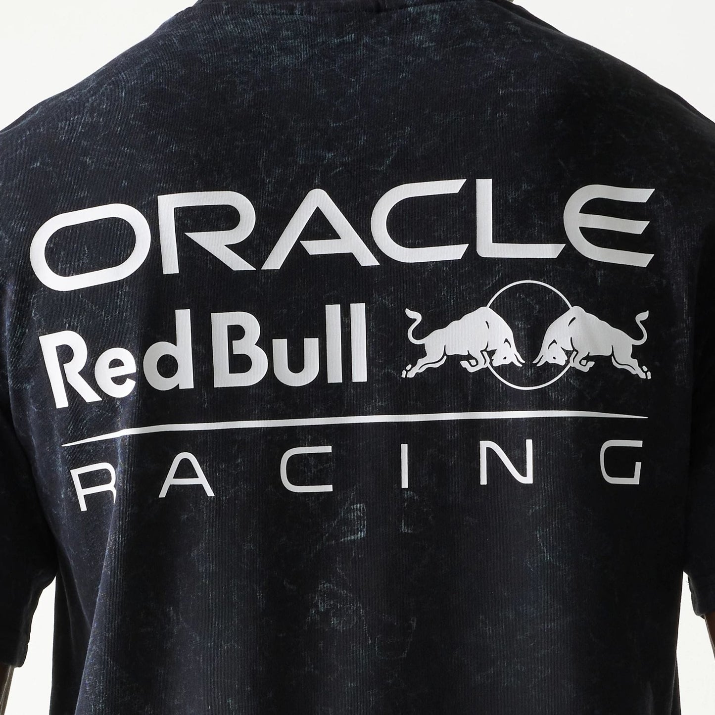The model is wearing this Red Bull Racing Linear Graphic Oversized T-Shirt in black. 6