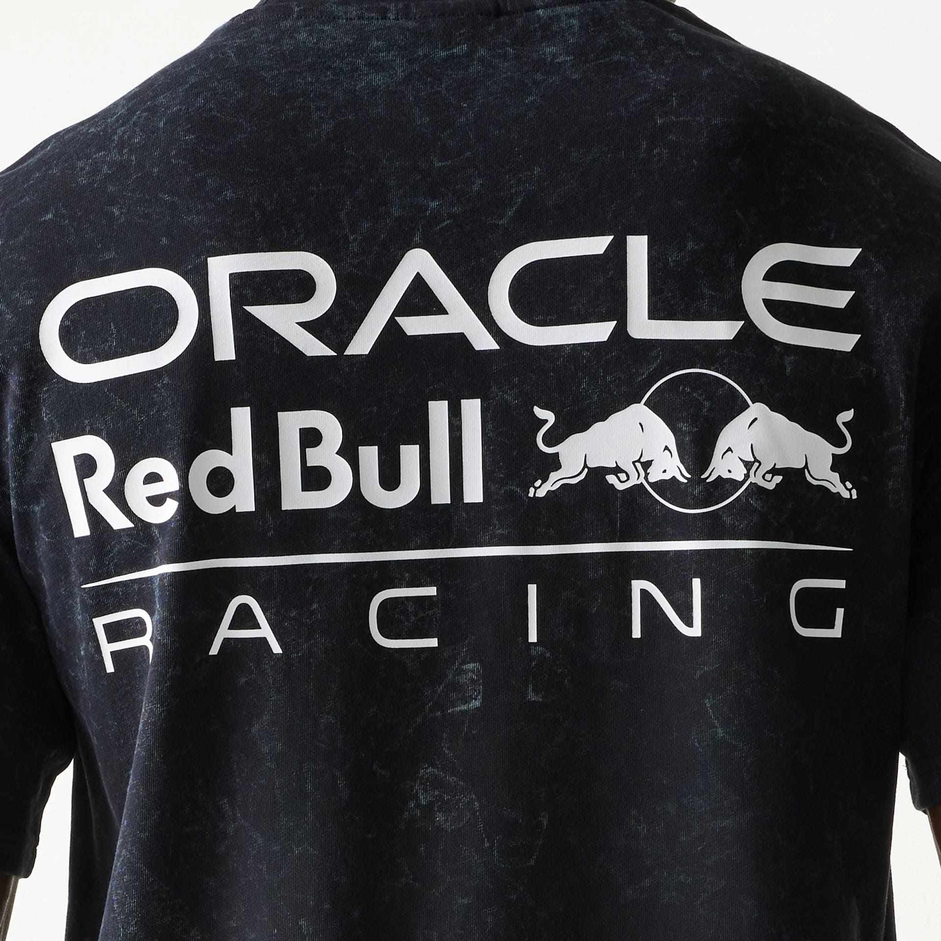 The model is wearing this Red Bull Racing Linear Graphic Oversized T-Shirt in black. 6