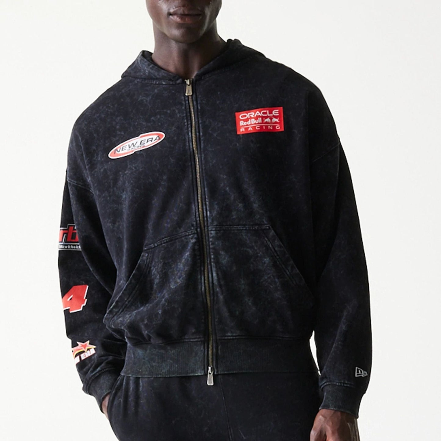 The model is wearing this Red Bull Racing Graphic Dropped Shoulder Full Zip Hoodie in black. 6