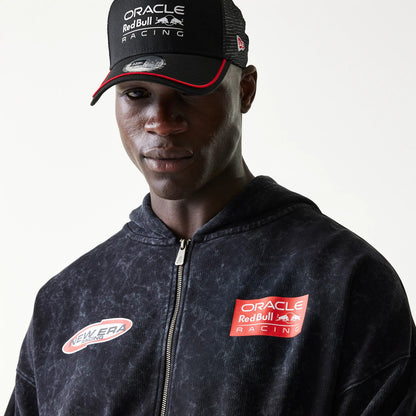 New Era Red Bull Racing Graphic Black Dropped Shoulder Full Zip Hoodie, front view showing a full zip down the centre, an embroidered Oracle Red Bull Racing patch on the left chest, and a New Era Racing patch on the right chest.
