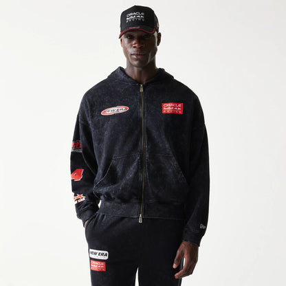 The model is wearing this Red Bull Racing Graphic Dropped Shoulder Full Zip Hoodie in black. 1