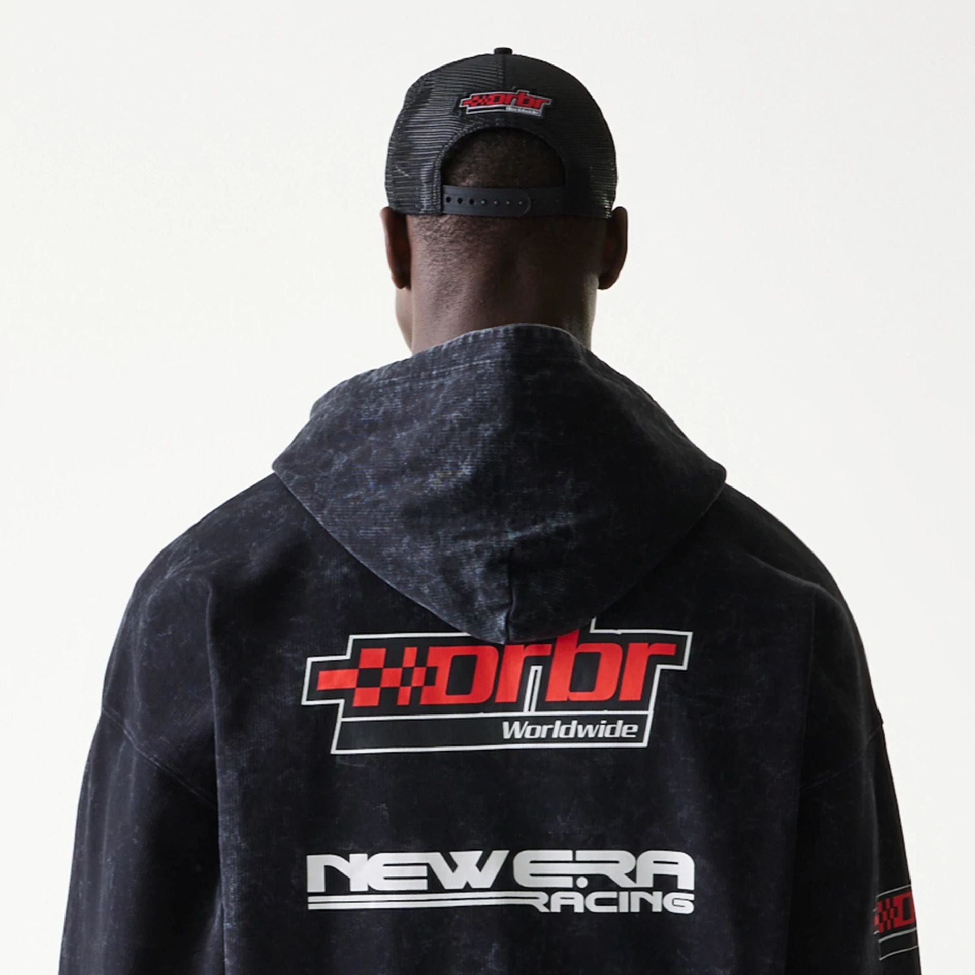The model is wearing this Red Bull Racing Graphic Dropped Shoulder Full Zip Hoodie in black. 4