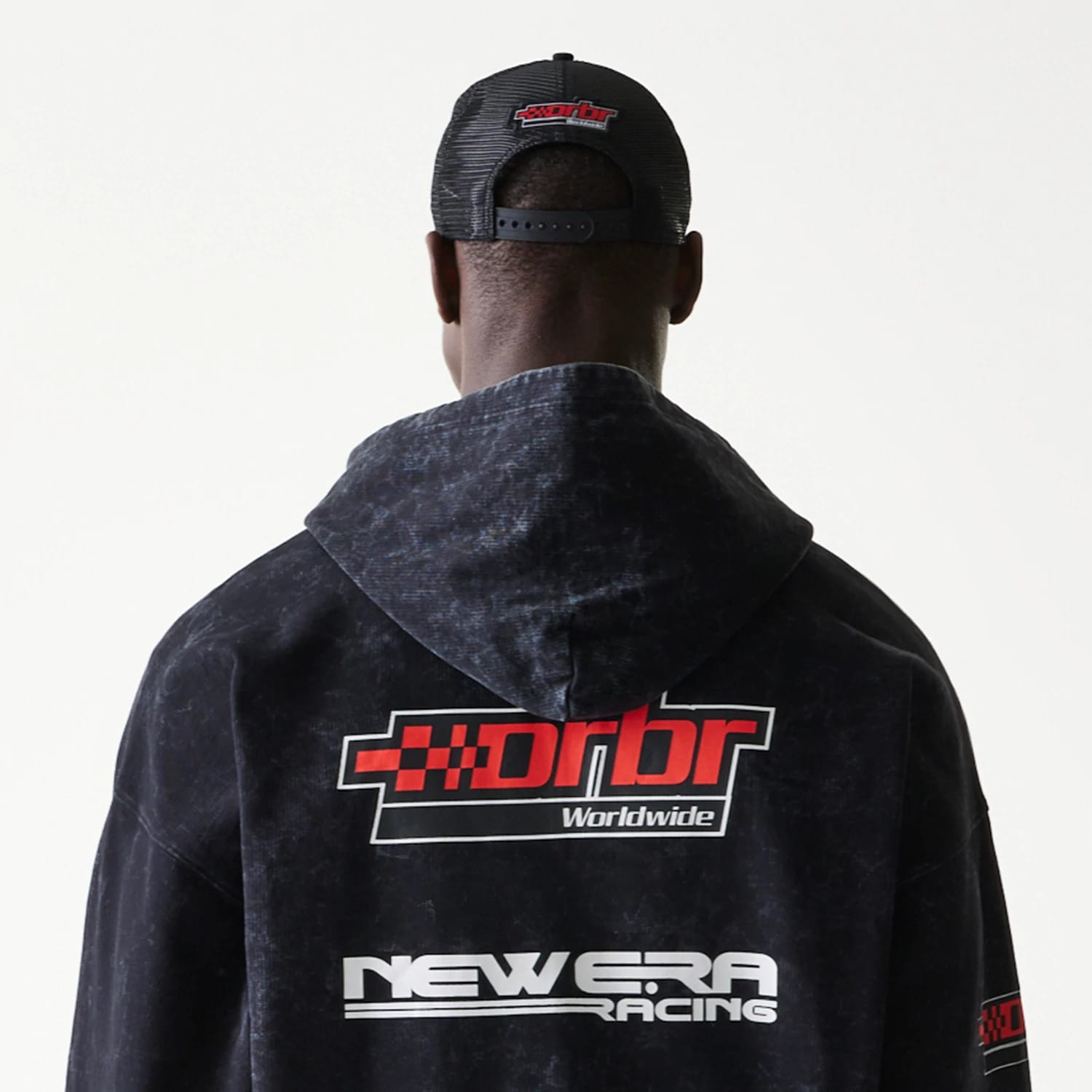 The model is wearing this Red Bull Racing Graphic Dropped Shoulder Full Zip Hoodie in black. 4