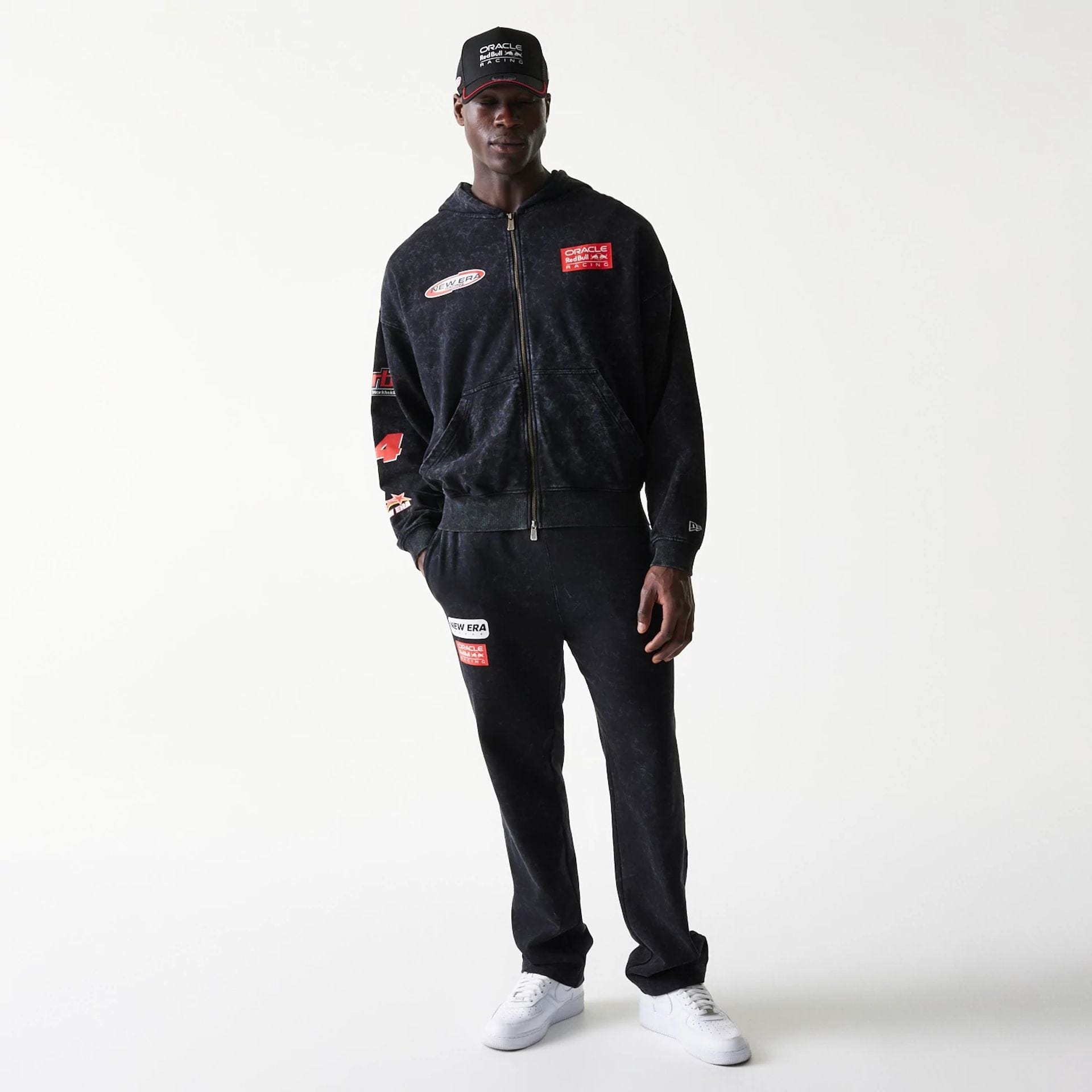 The model is wearing this Red Bull Racing Graphic Dropped Shoulder Full Zip Hoodie in black. 5