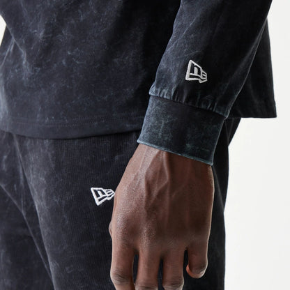 The model is wearing this Red Bull Racing Graphic Long Sleeve T-Shirt in black. 5