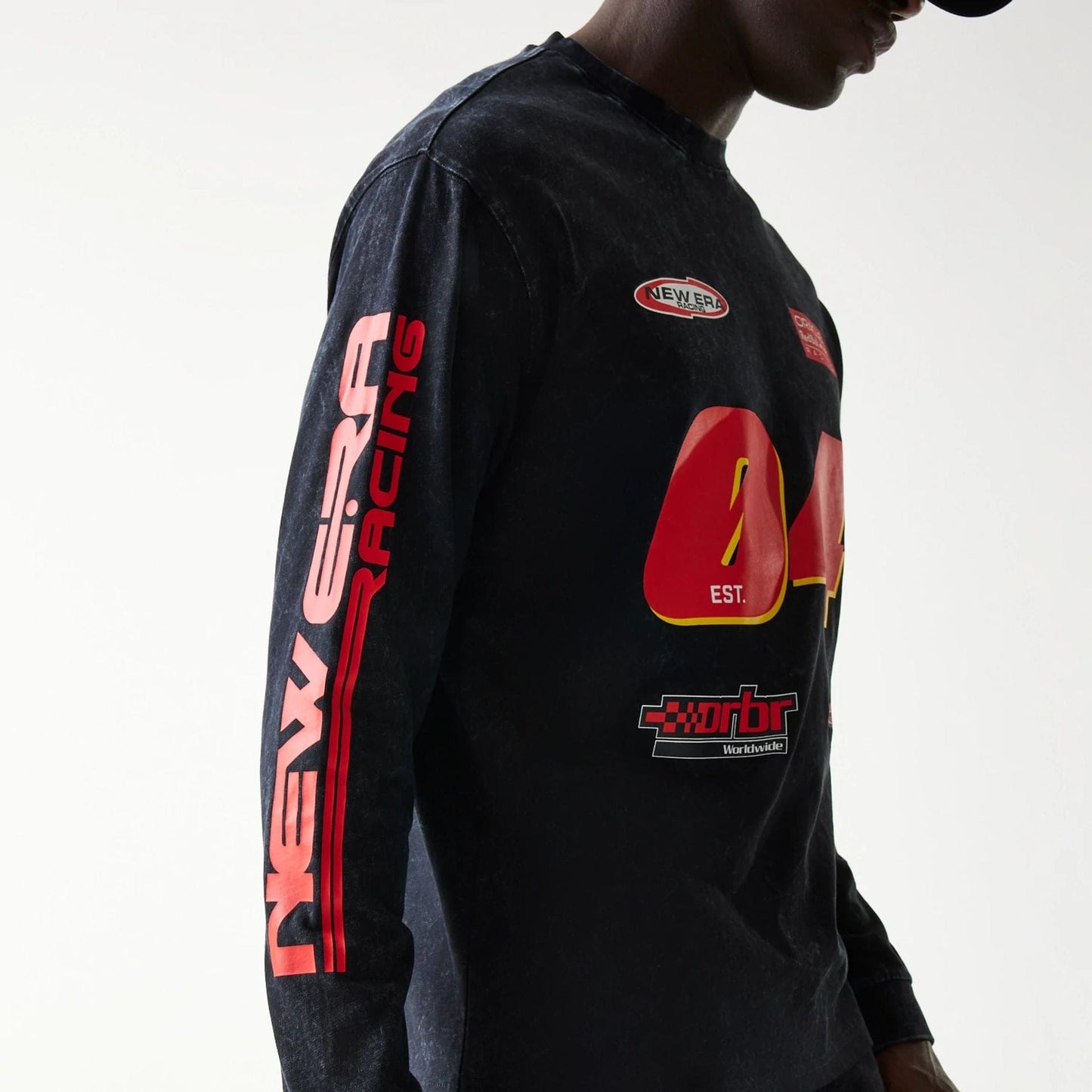The model is wearing this Red Bull Racing Graphic Long Sleeve T-Shirt in black. 6