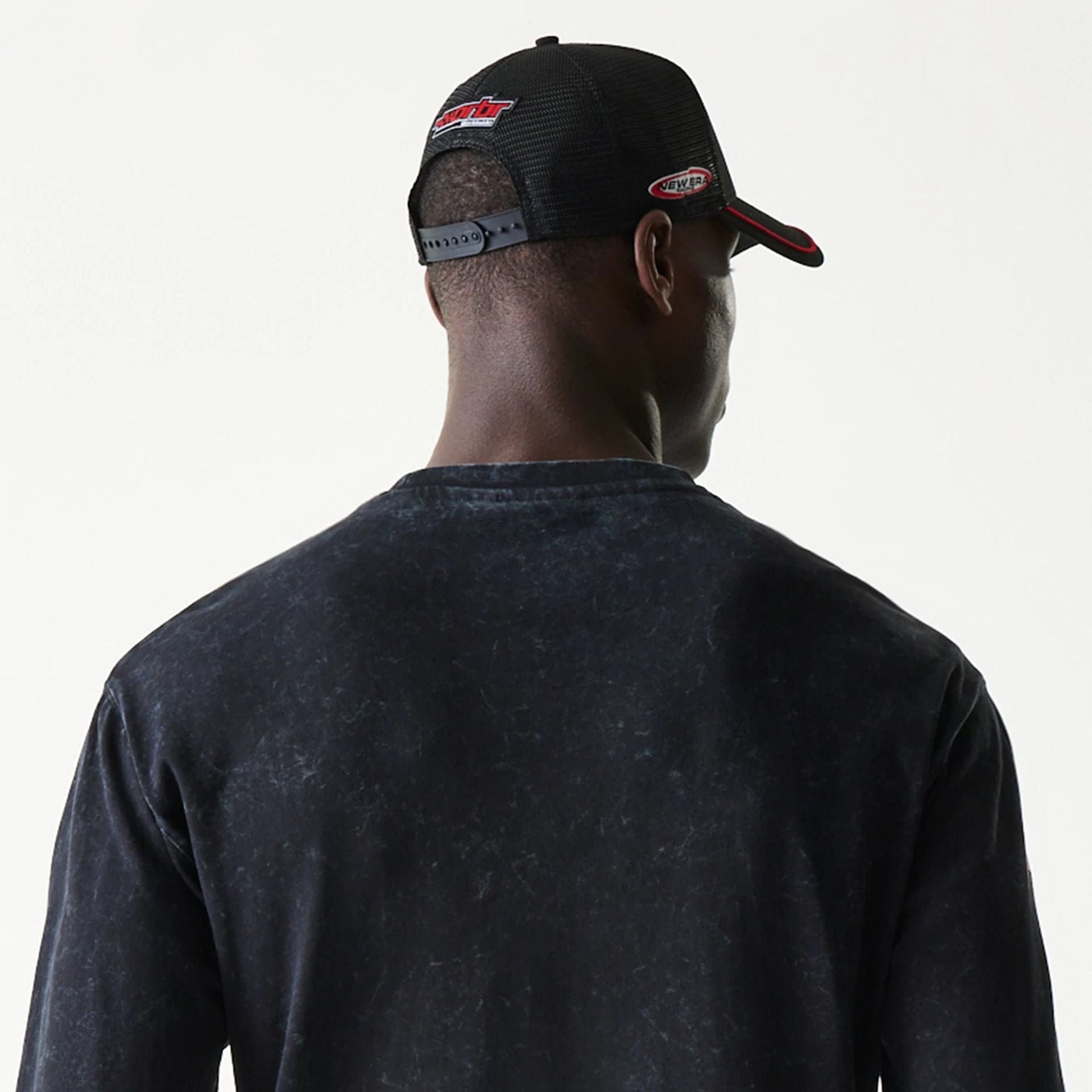 The model is wearing this Red Bull Racing Graphic Long Sleeve T-Shirt in black. 7
