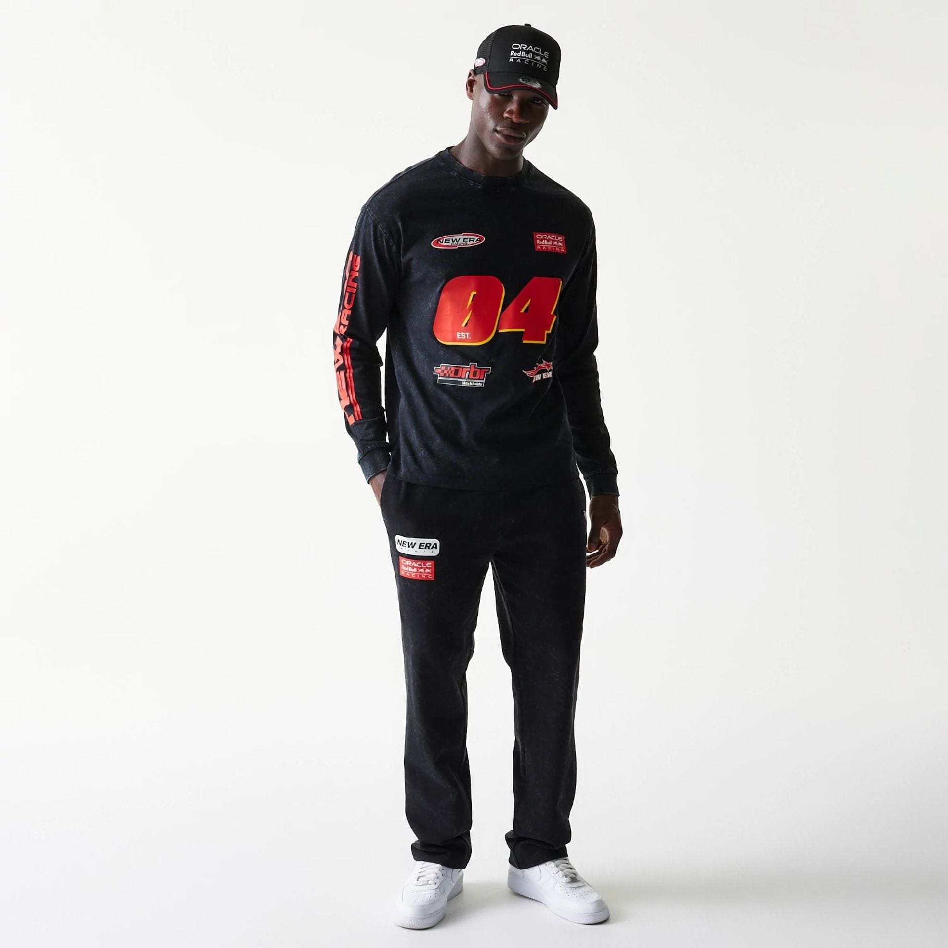 The model is wearing this Red Bull Racing Graphic Long Sleeve T-Shirt in black. 8