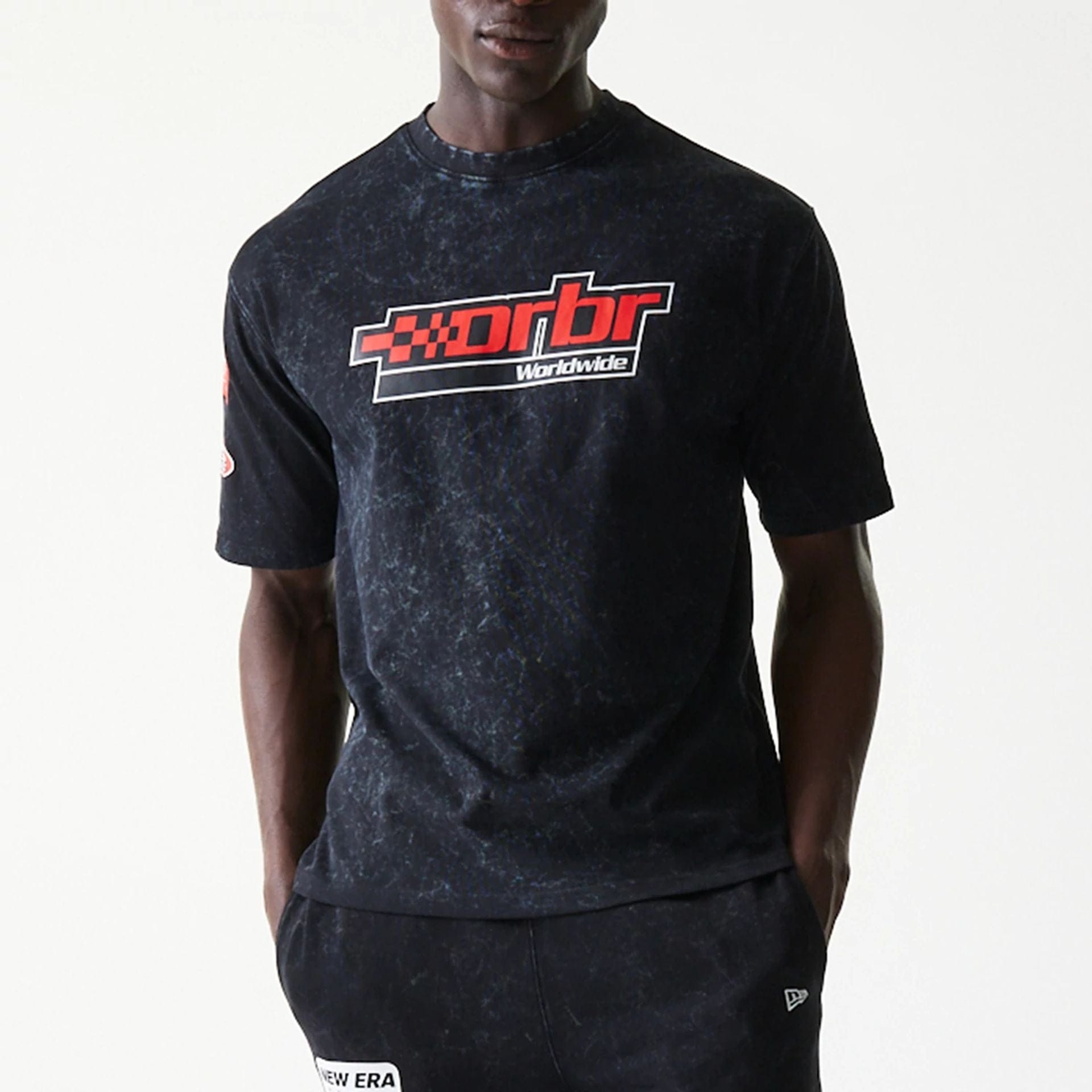 The model is wearing this Red Bull Racing Graphic Oversized T-Shirt in black. 3