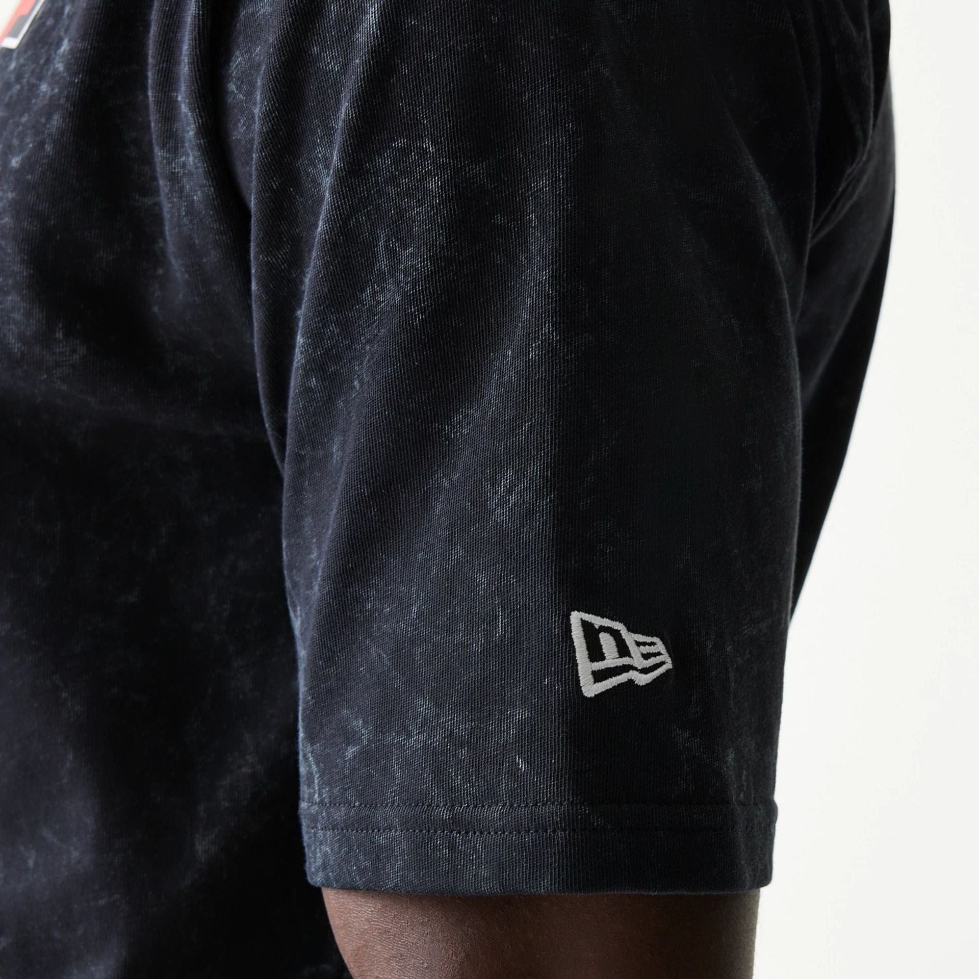 The model is wearing this Red Bull Racing Graphic Oversized T-Shirt in black. 5