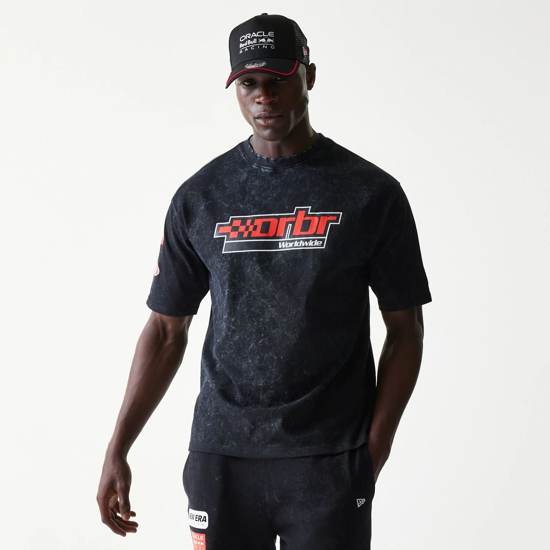 The model is wearing this Red Bull Racing Graphic Oversized T-Shirt in black. 1
