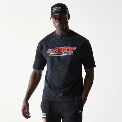 The model is wearing this Red Bull Racing Graphic Oversized T-Shirt in black. 1