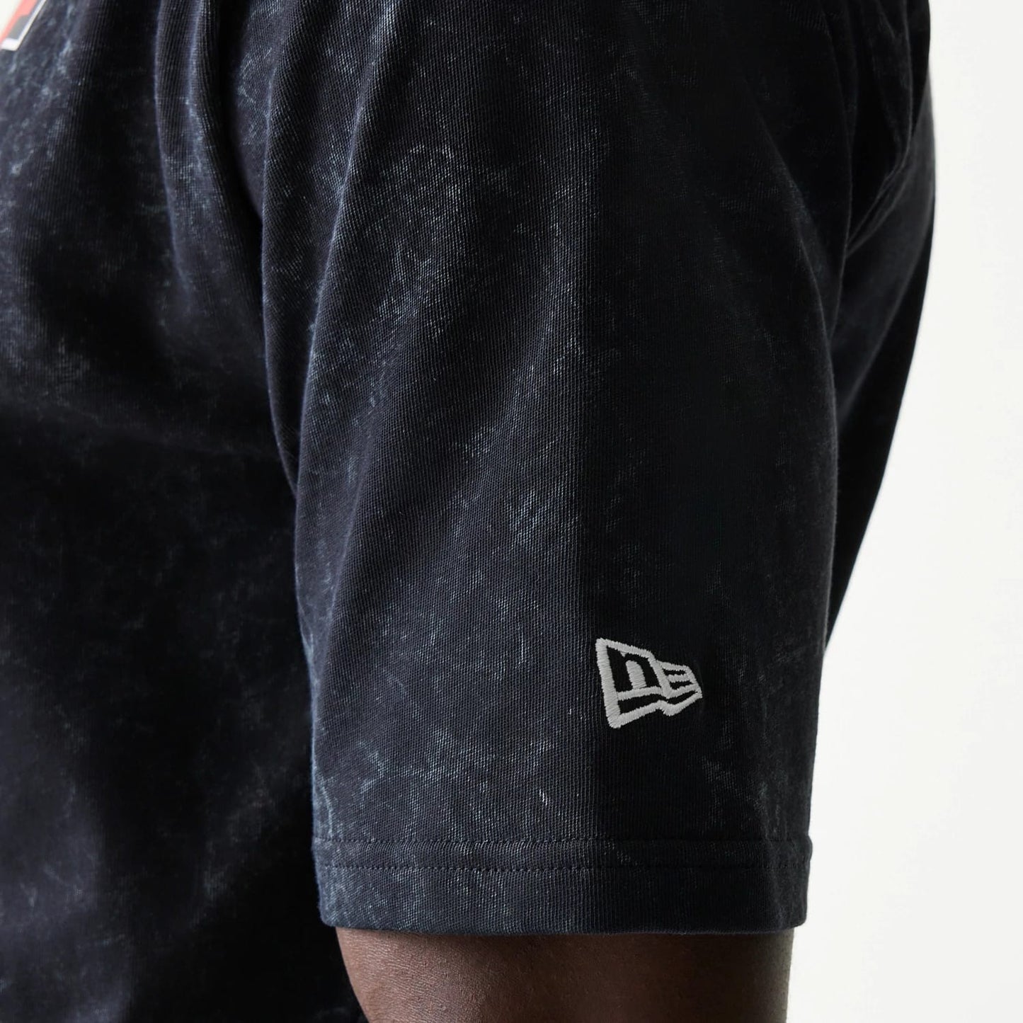 The model is wearing this Red Bull Racing Graphic Oversized T-Shirt in black. 5