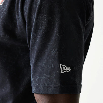 The model is wearing this Red Bull Racing Graphic Oversized T-Shirt in black. 5