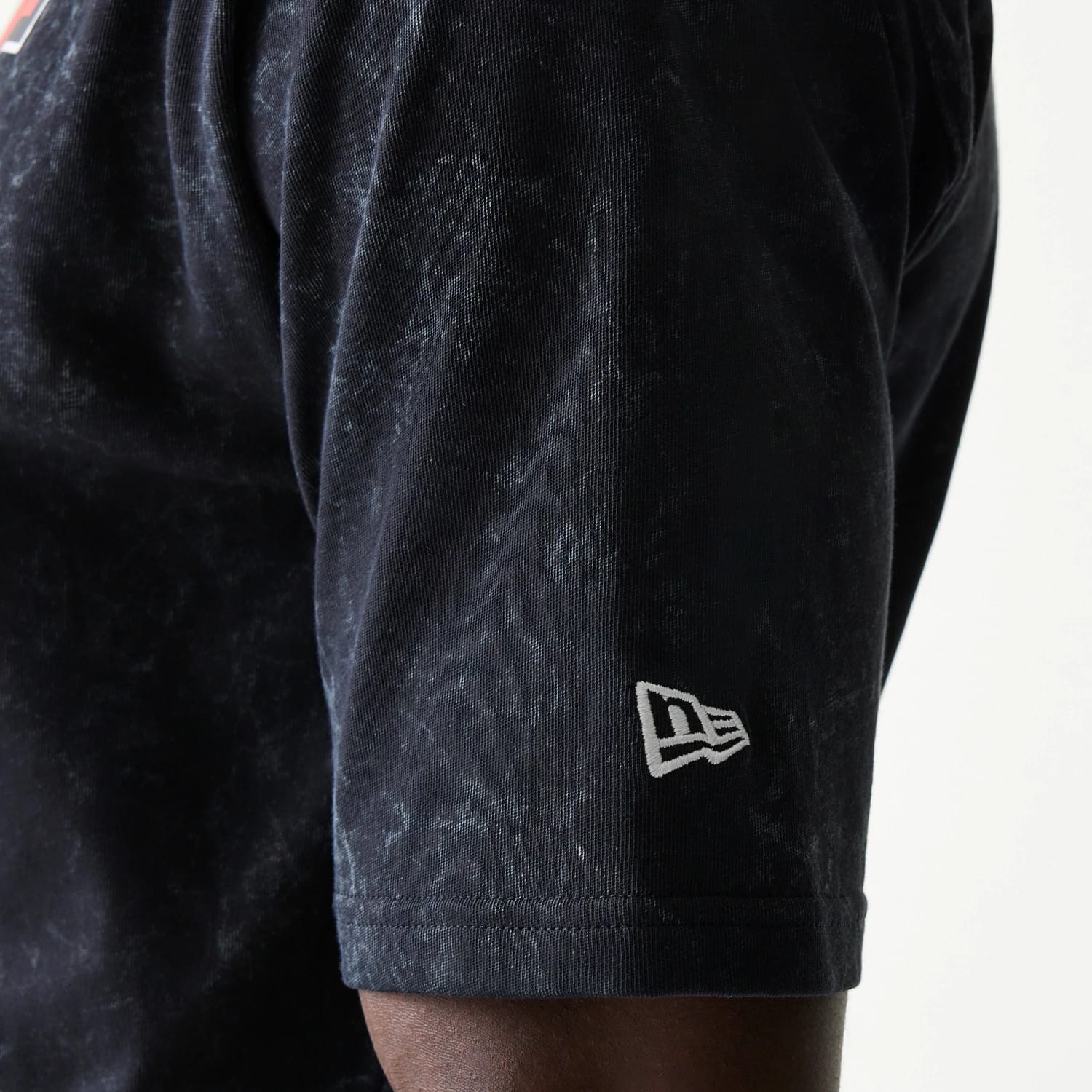 The model is wearing this Red Bull Racing Graphic Oversized T-Shirt in black. 5