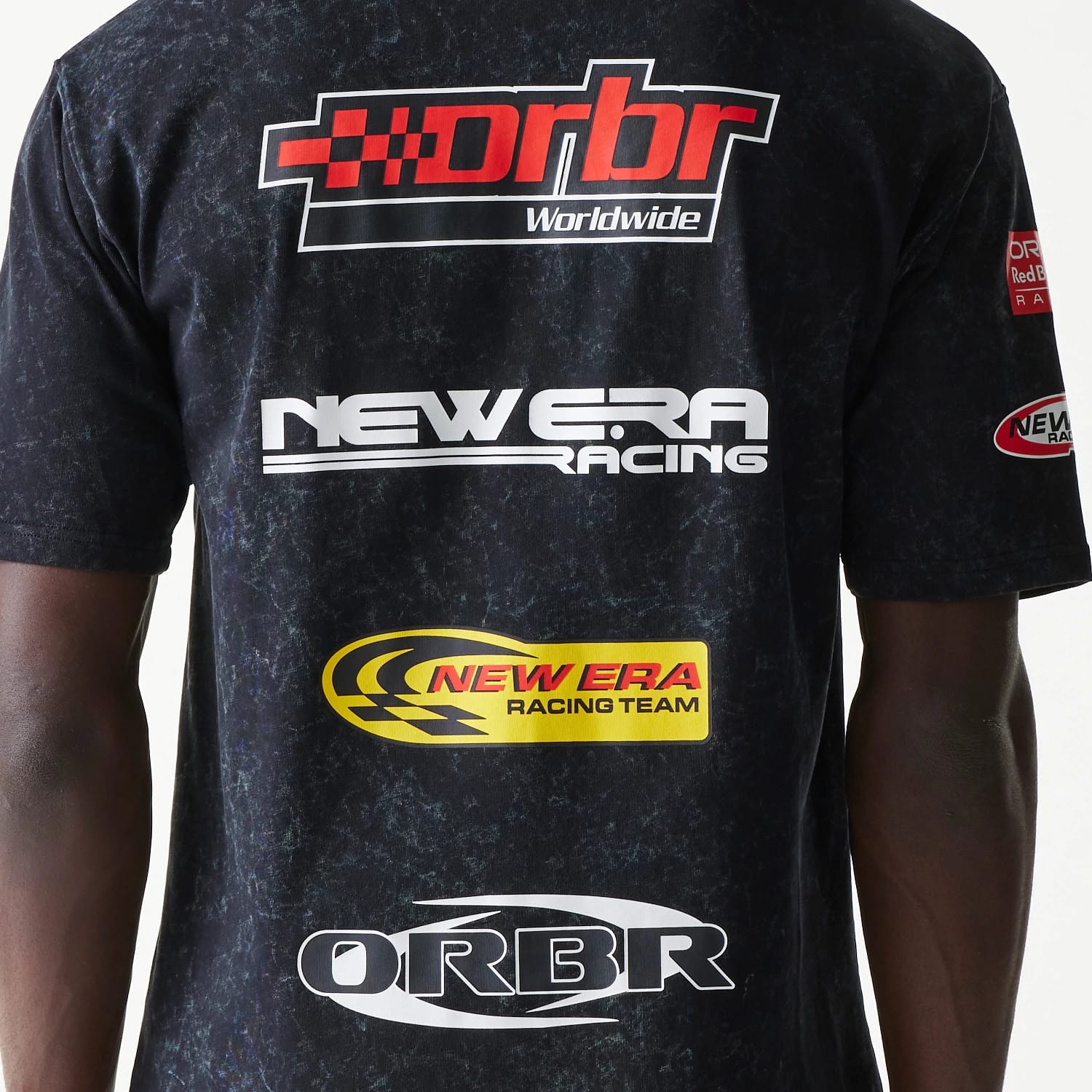 The model is wearing this Red Bull Racing Graphic Oversized T-Shirt in black. 7