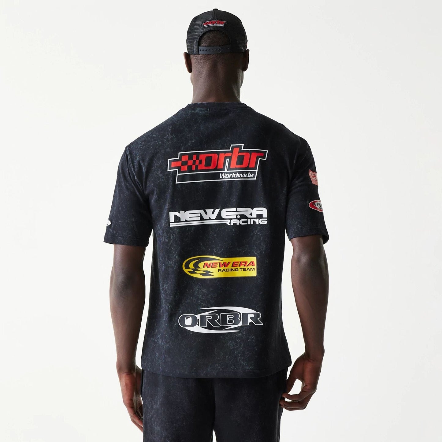 The model is wearing this Red Bull Racing Graphic Oversized T-Shirt in black. 2
