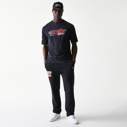 The model is wearing this Red Bull Racing Graphic Oversized T-Shirt in black. 8
