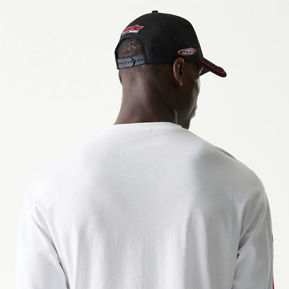 The model is wearing this Red Bull Racing Graphic Long Sleeve T-Shirt in white. 6