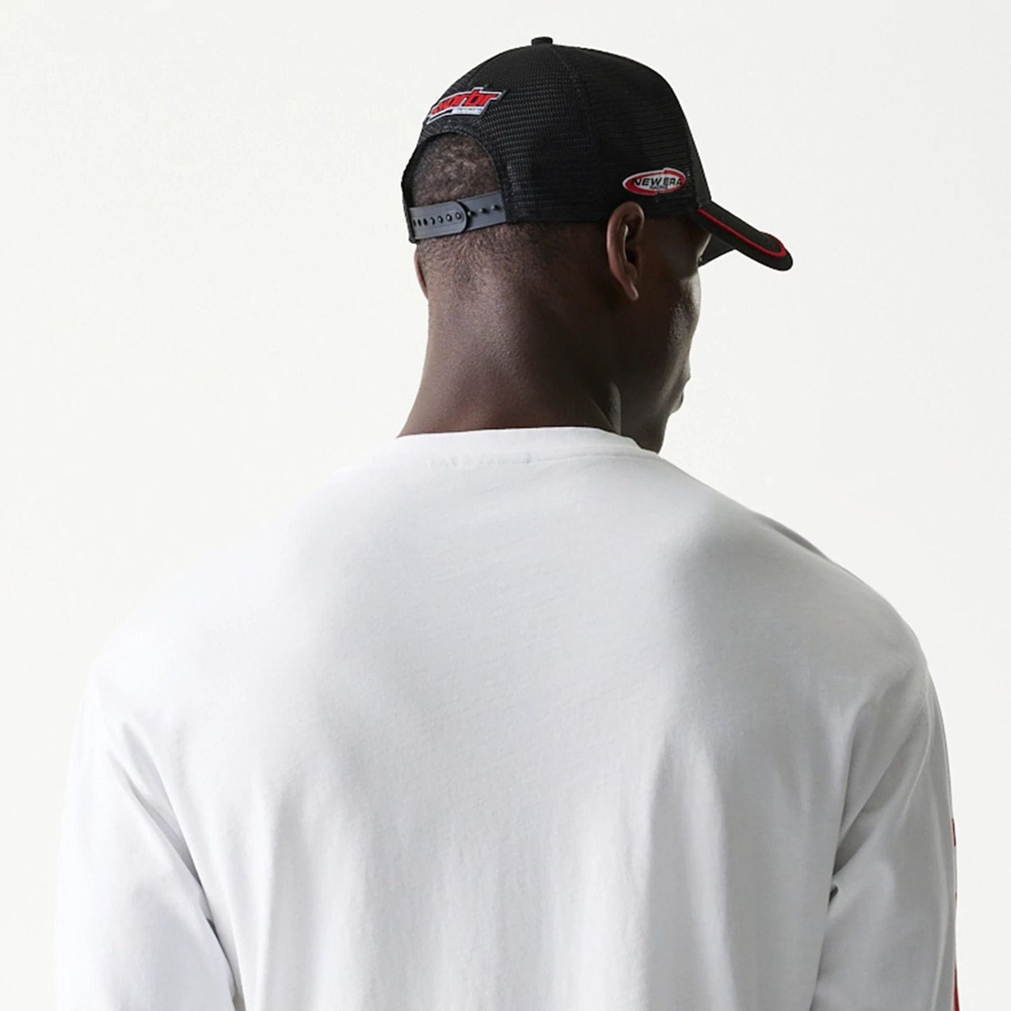 The model is wearing this Red Bull Racing Graphic Long Sleeve T-Shirt in white. 6