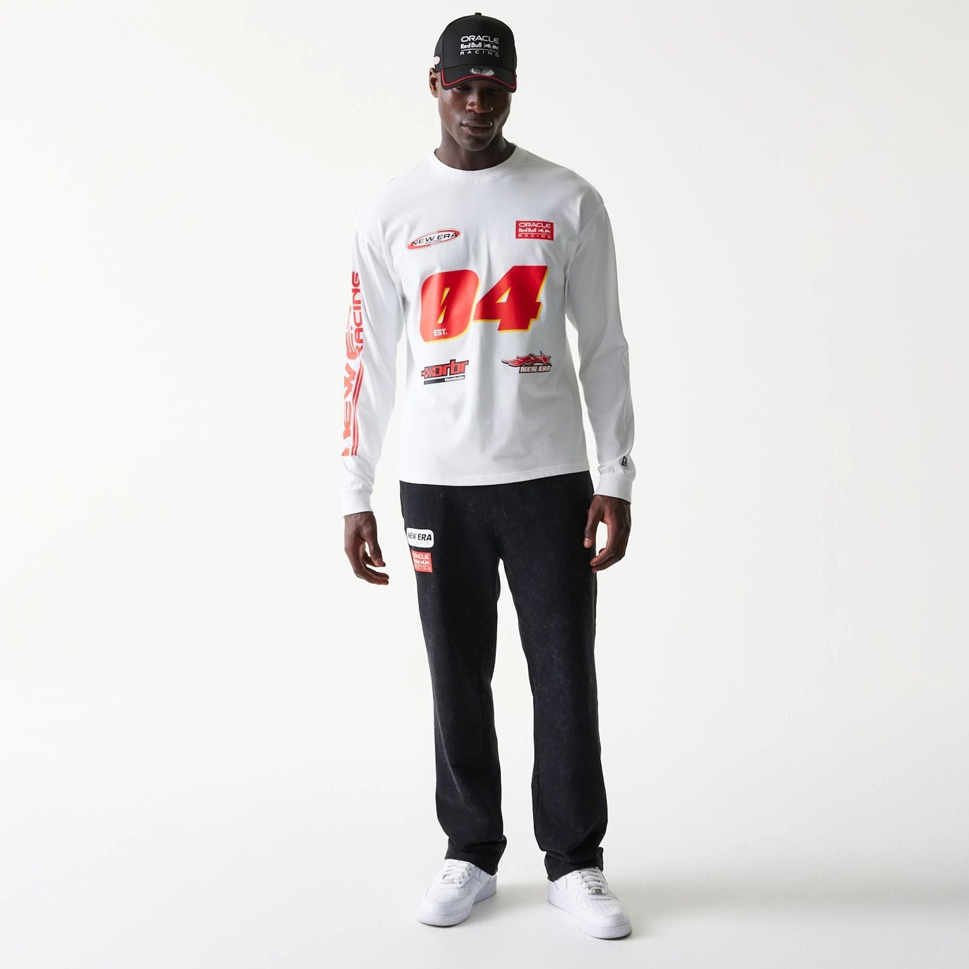 The model is wearing this Red Bull Racing Graphic Long Sleeve T-Shirt in white. 7