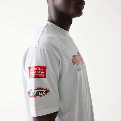 The model is wearing this Red Bull Racing Graphic Oversized T-Shirt in white. 5