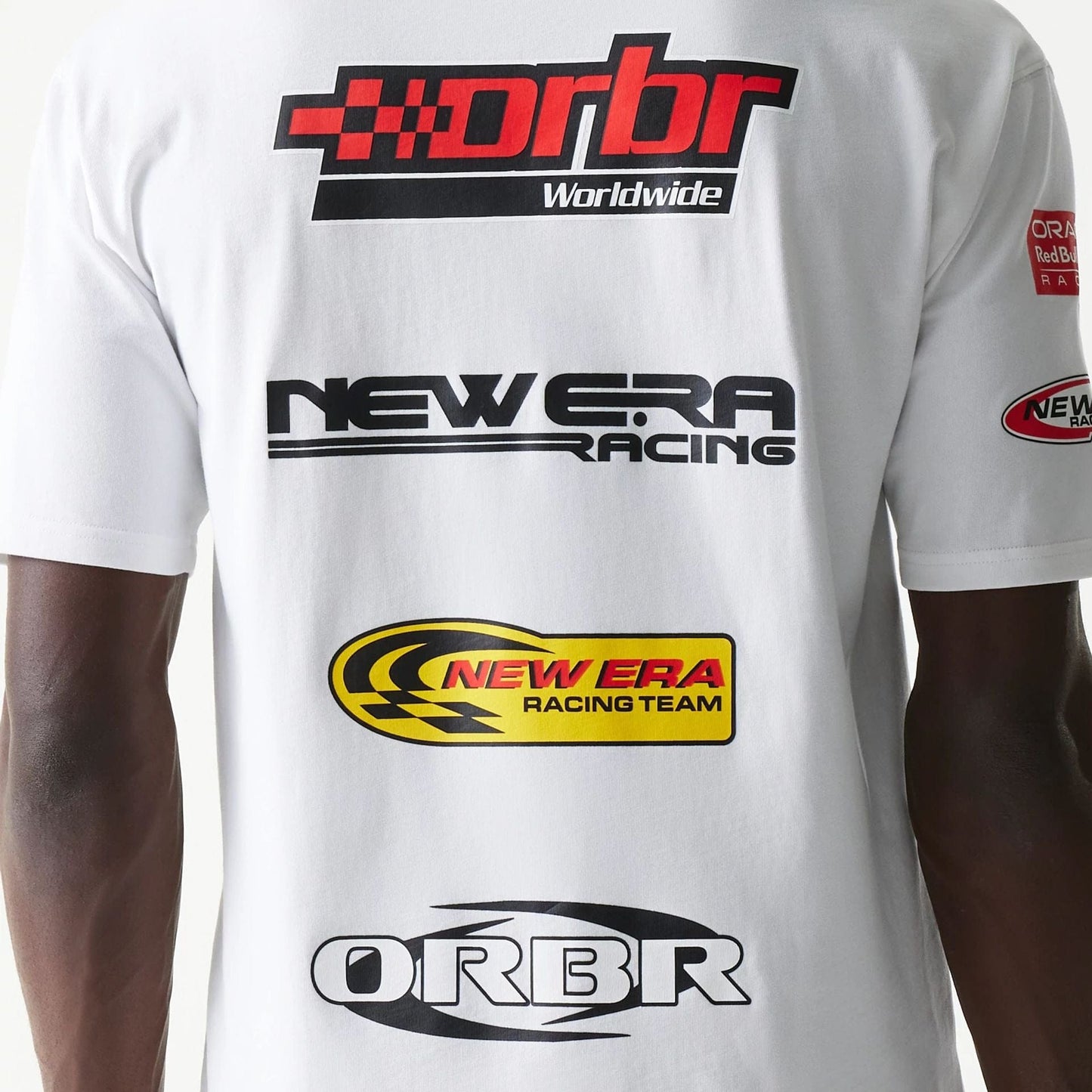 The model is wearing this Red Bull Racing Graphic Oversized T-Shirt in white. 6