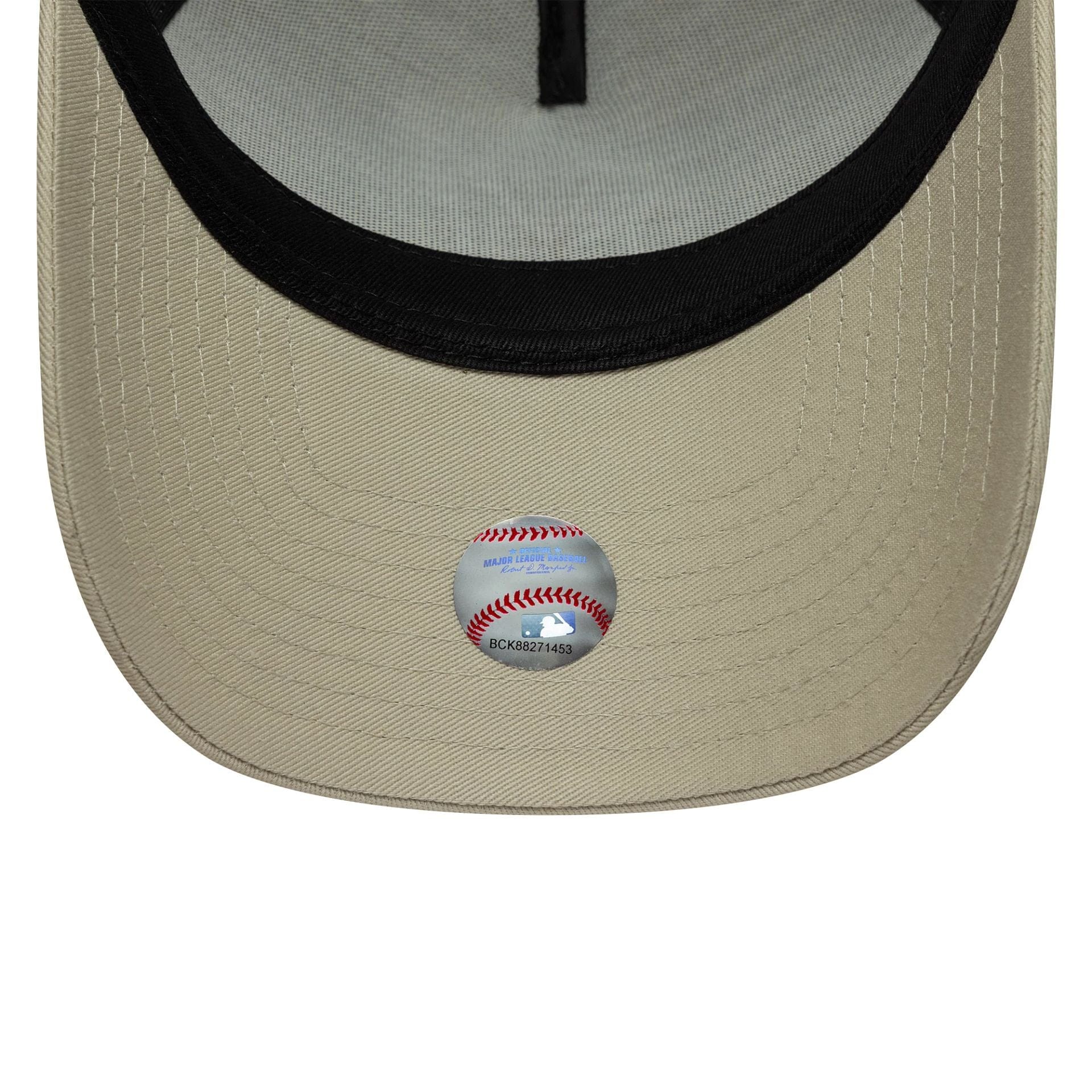 Pictured is this MLB League Essential New York Yankees 9FORTY A-Frame Trucker in light beige. 5
