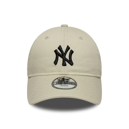 Pictured is this Youth MLB League Essential New York Yankees 9TWENTY in light beige. 2