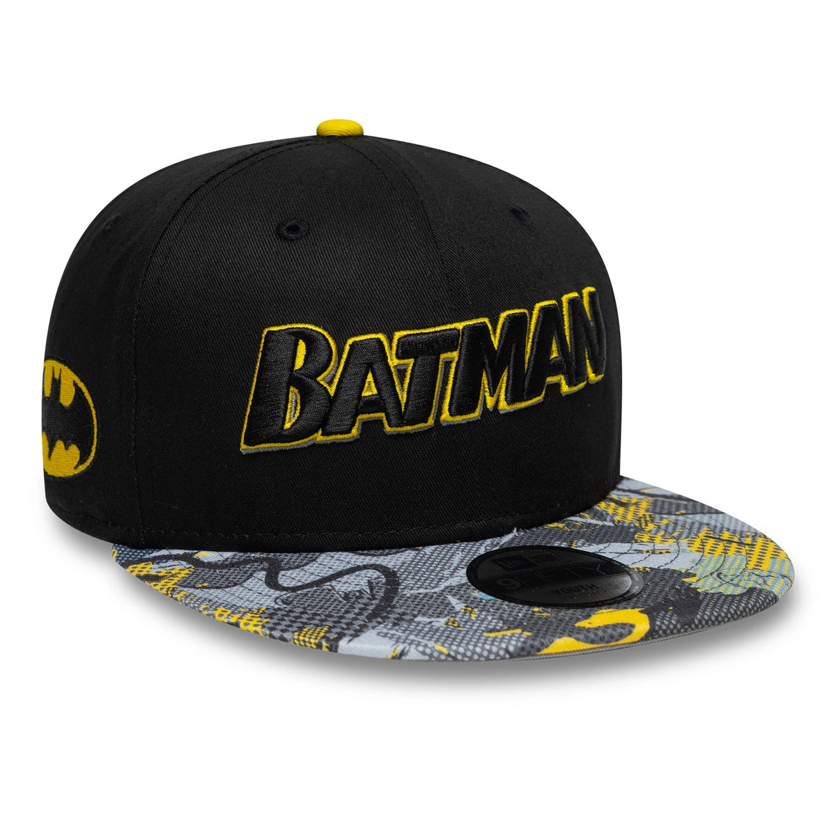 Youth DC Batman Black New Era 9FIFTY Snapback Cap, three-quarter view showing the yellow and black Batman lettering in raised embroidery on the front panel, with a patterned visor and a 9FIFTY size sticker.