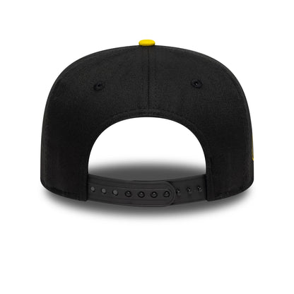 Youth DC Batman Black New Era 9FIFTY Snapback Cap, rear view featuring a yellow top button and adjustable black snap closure, with a structured black crown and matching black eyelets.