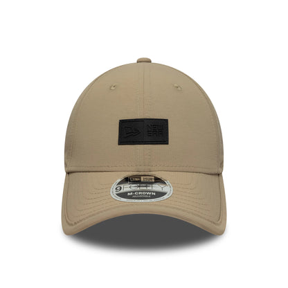 Pictured is this New Era Sport 9FORTY M-Crown in light beige. 2