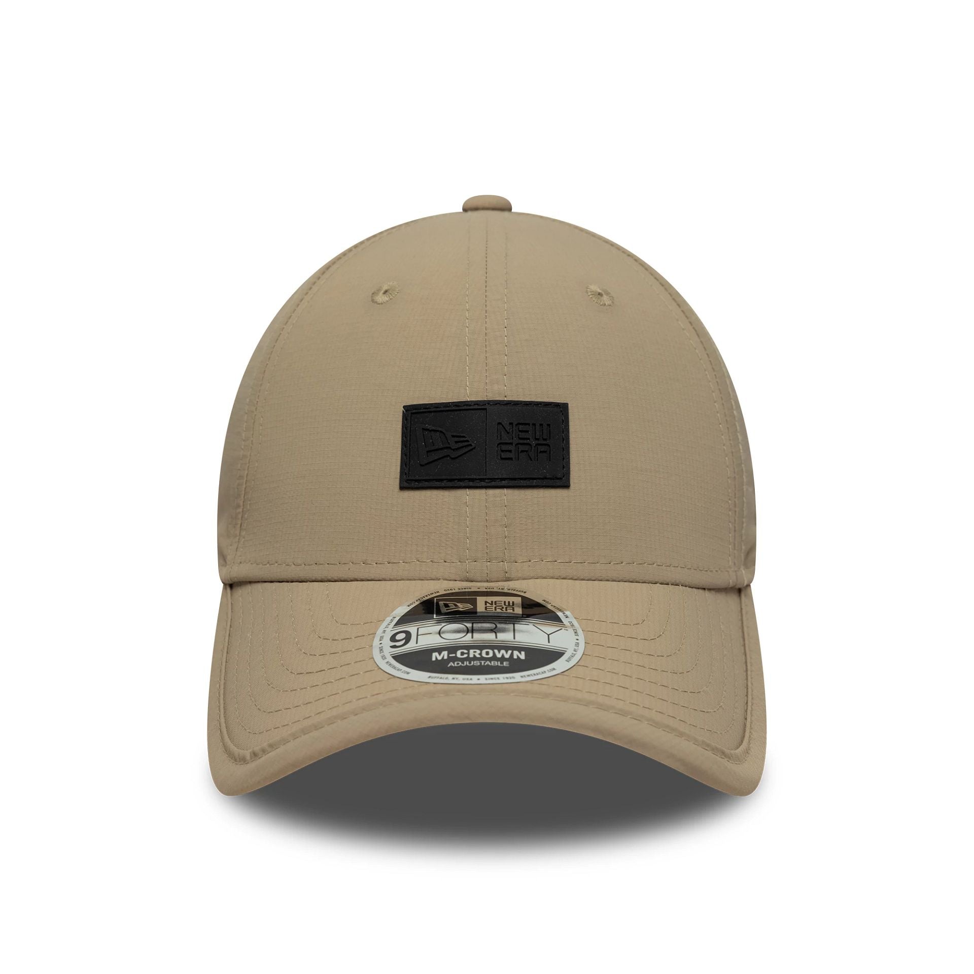 Pictured is this New Era Sport 9FORTY M-Crown in light beige. 2