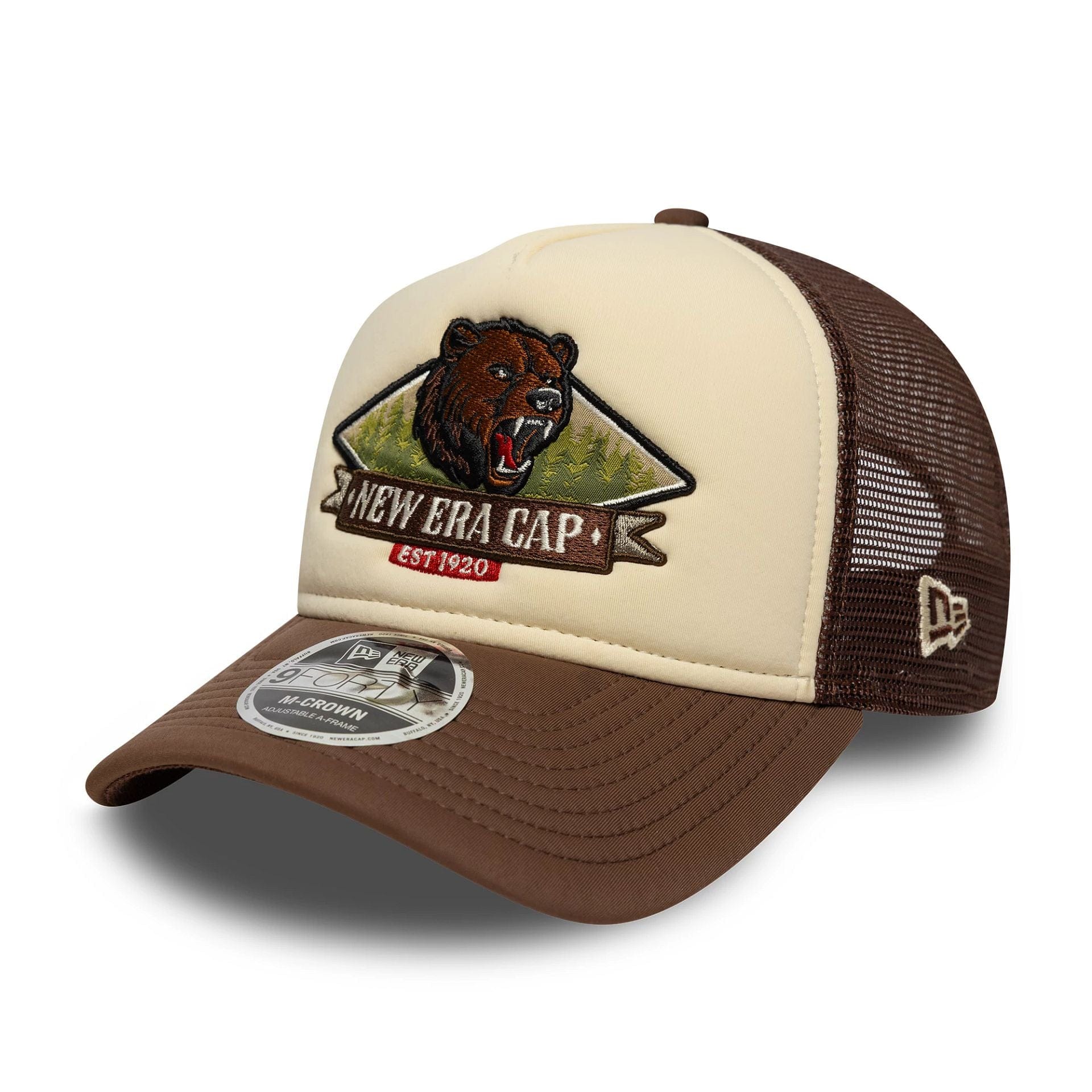 Pictured is this New Era Graphic 9FORTY M-Crown A-Frame Trucker in light beige. 1