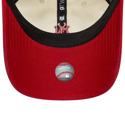 New York Yankees MLB Mini Logo Red New Era 9TWENTY Cap, inside view showing the black sweatband, MLB baseball sticker on the red undervisor and white interior taping with printed text details.