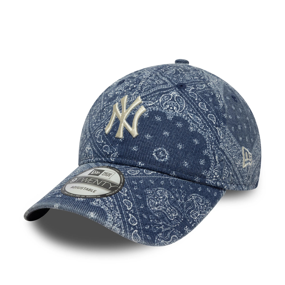 New York Yankees MLB Washed Paisley Navy New Era 9TWENTY Cap, three-quarter view showing a white raised embroidered NY logo on the front panel, navy paisley pattern across the entire cap, and a 9TWENTY size sticker on the curved visor.