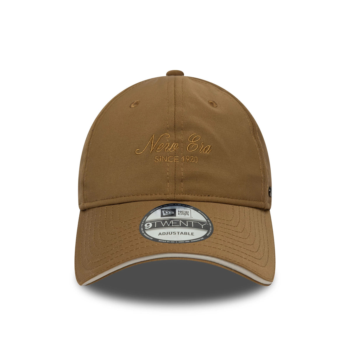 New Era Heritage Light Beige New Era 9TWENTY Cap, front view showing embroidered New Era script and Since 1920 on the structured crown, with a curved visor featuring a 9TWENTY size sticker and contrasting white undervisor edge.