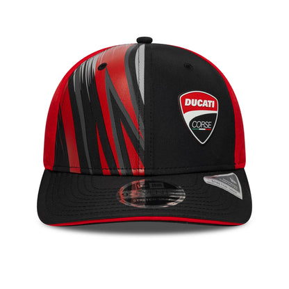 Ducati Motor Logo Print Black New Era 9SEVENTY Stretch Snap Cap, front view showing the red and grey graphic pattern on the structured black crown with a raised embroidered Ducati Corse badge and a 9SEVENTY size sticker on the black visor.