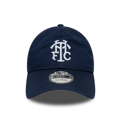 Tottenham Hotspur FC Monogram Navy New Era 9TWENTY Adjustable Cap, front view showing the white embroidered THFC monogram logo on the structured navy crown, with a 9TWENTY size sticker on the curved visor.