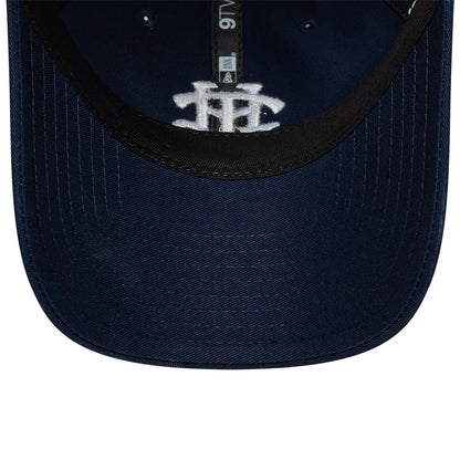 Tottenham Hotspur FC Monogram Navy New Era 9TWENTY Adjustable Cap, inside view showing a black sweatband, a grey crown seam tape running from front to back, and a white TH monogram embroidered on the navy undervisor.