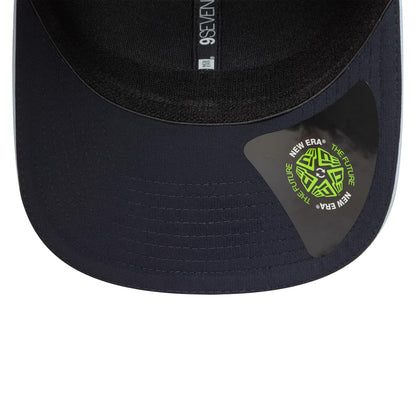 Tottenham Hotspur FC Cockerel Navy New Era 9SEVENTY Stretch Snap Cap, inside view showing black sweatband with grey taping featuring 9SEVENTY branding and a green New Era The Future sticker on the navy undervisor.