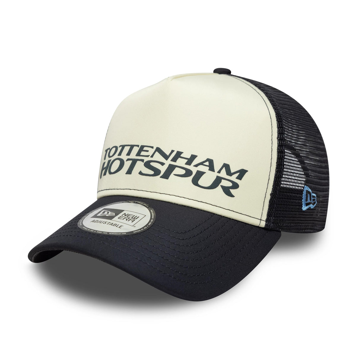 Tottenham Hotspur FC Puff Wordmark Navy New Era 9FORTY A-Frame Trucker Cap, three-quarter view showing the raised navy Tottenham Hotspur text on the cream front panel, a mesh back, black visor, and a New Era logo on the left side.