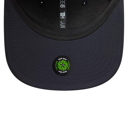 Chelsea FC Lion Crest Iridescent Navy New Era 9SEVENTY Stretch Snap Cap, inside view showing the grey sweatband, branded taping with New Era and 9SEVENTY markings, and a green The Future sticker on the dark undervisor.