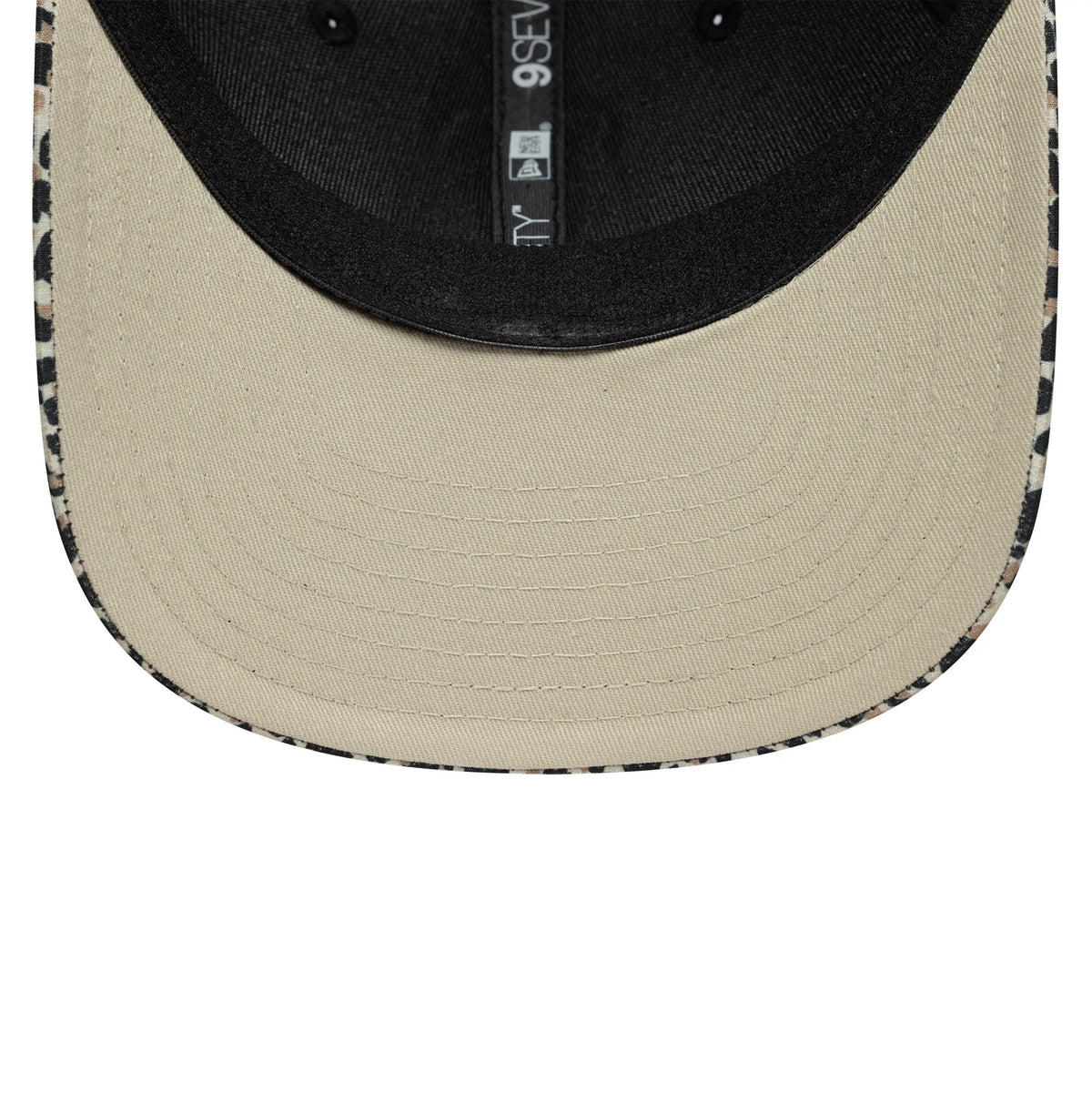 Visa Cash App Racing Bulls Leopard New Era 9SEVENTY Stretch Snap Cap, inside view showing the black taping and sweatband, with a beige undervisor and patterned leopard trim along the edge of the visor.